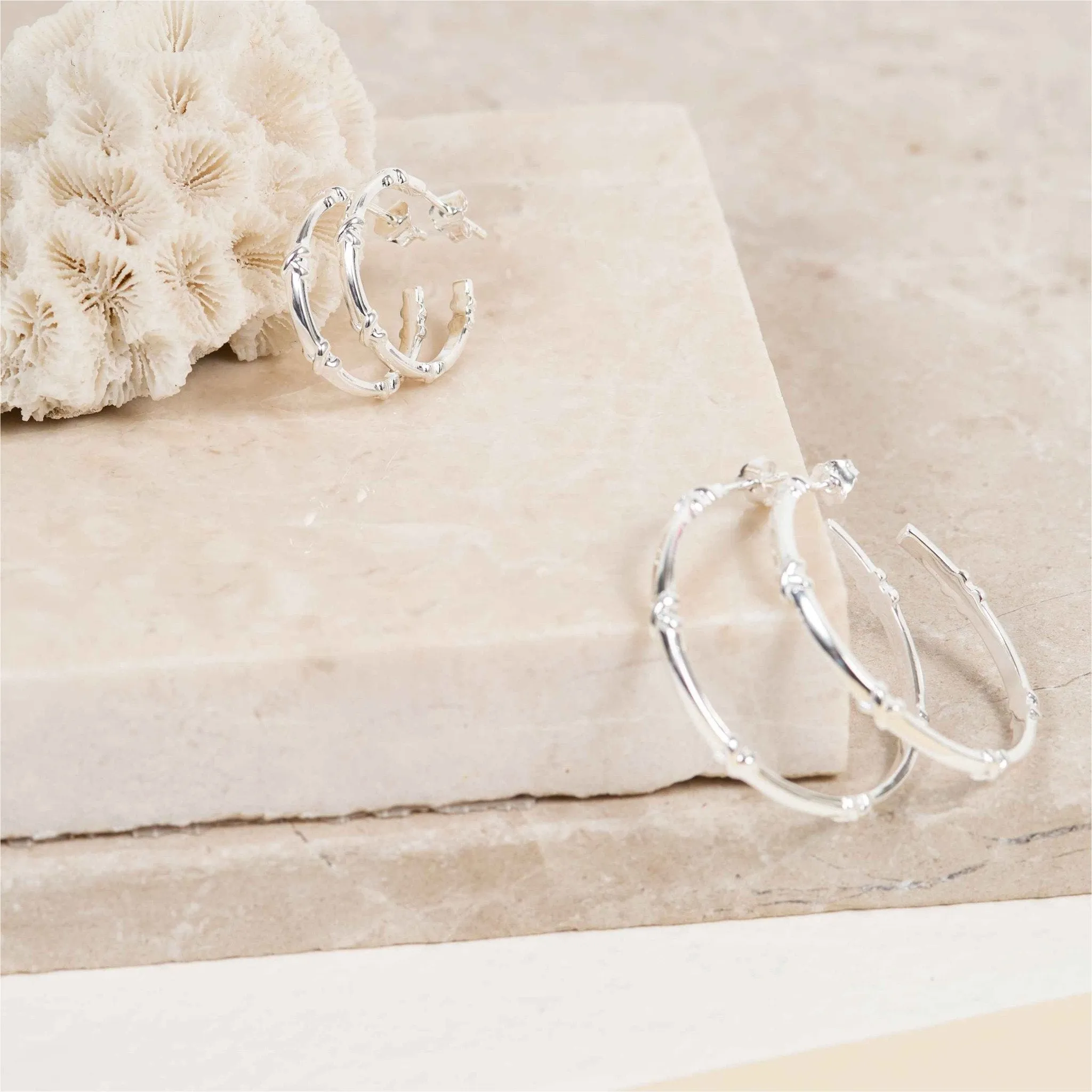 Deia Large Sterling Silver Kiss Hoop Earrings